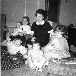  

Christmas 1959, Karen and mother and sister, mother is due with fifth child, a boy.
 
